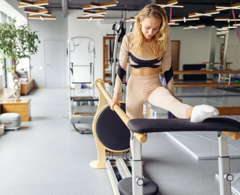 healthy-focused-woman-practicing-pilates-having-r-2022-08-29-20-52-36-utc-e1700798222405.webp